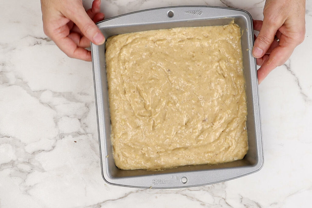 Cake batter in a baking pan.