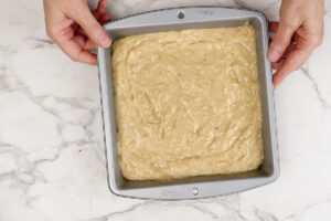 Cake batter in a baking pan.