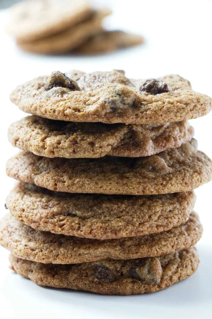 A stack of six whole wheat spelt chocolate chip cookies.