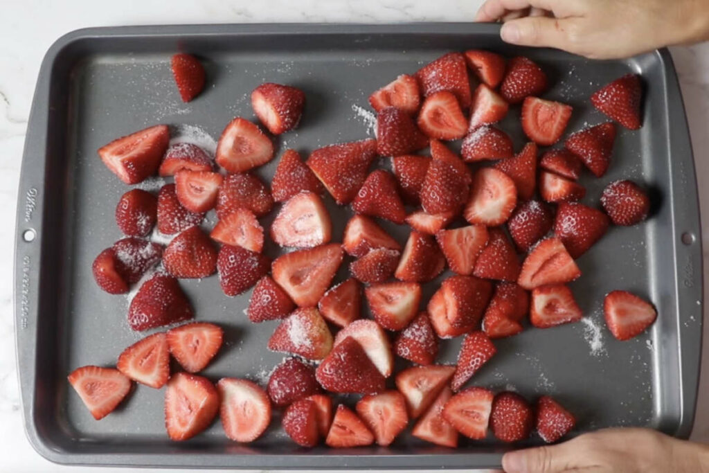 Roasting strawberries on a sheet pan.