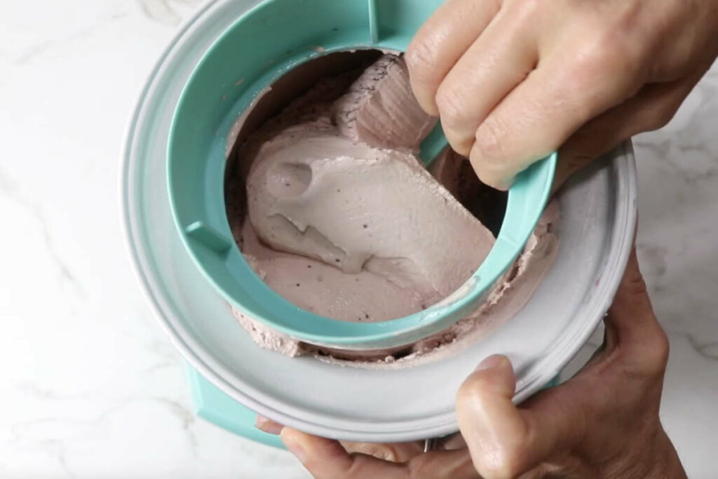 Freezing the ice cream in a churner.