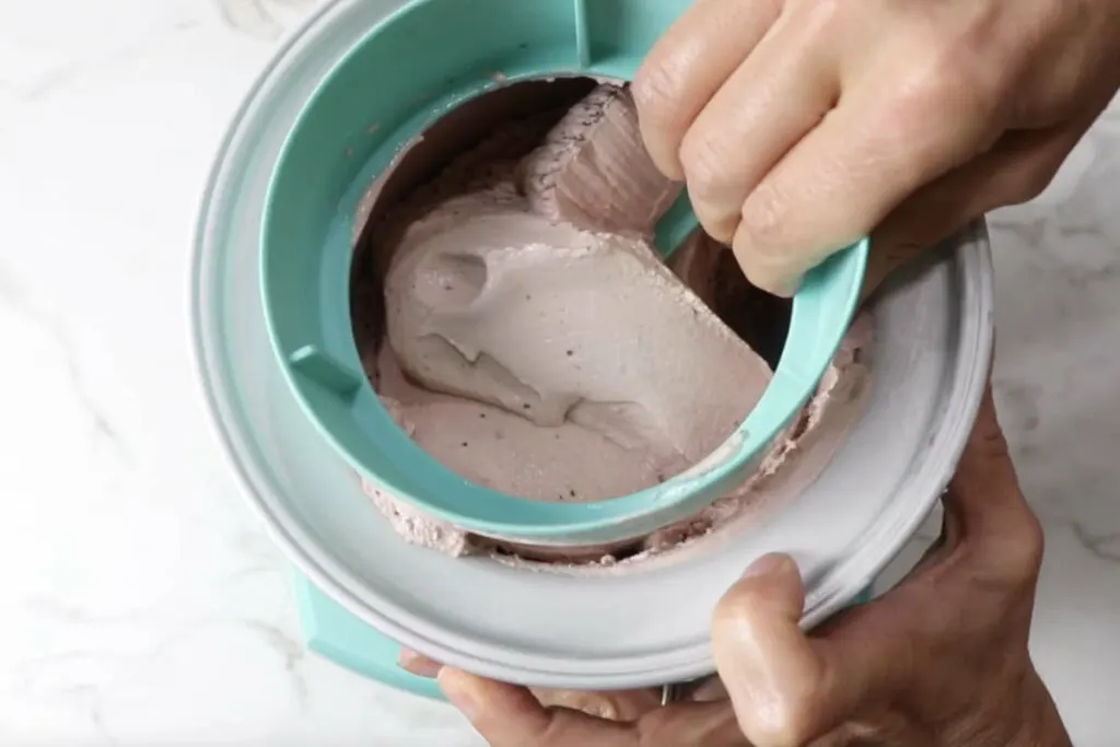 Freezing the ice cream in a churner.