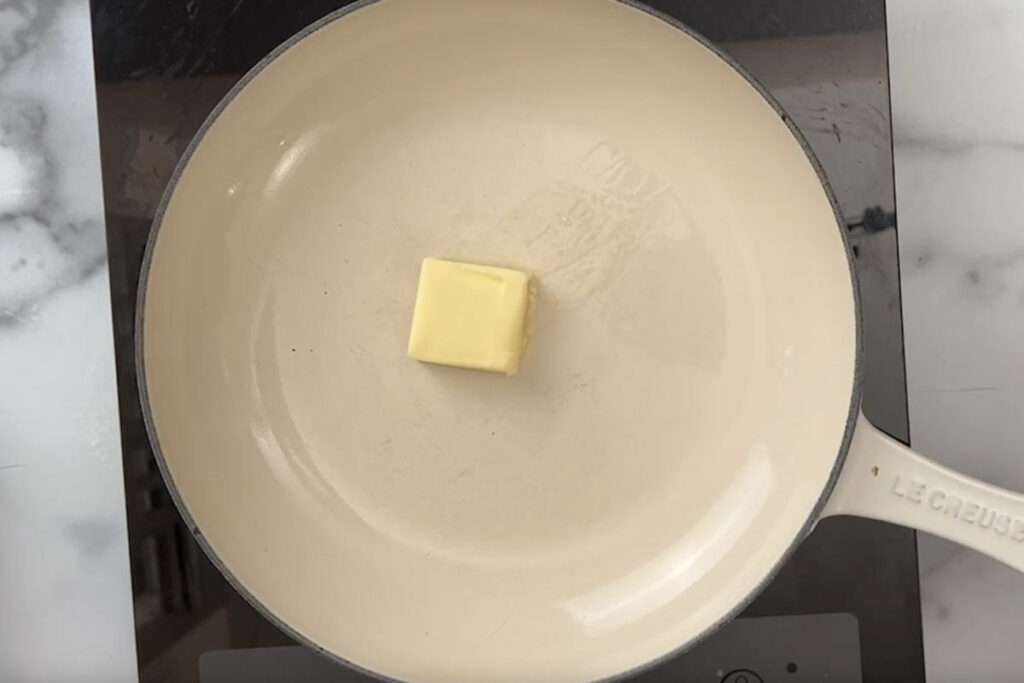 Melting butter in a skillet.