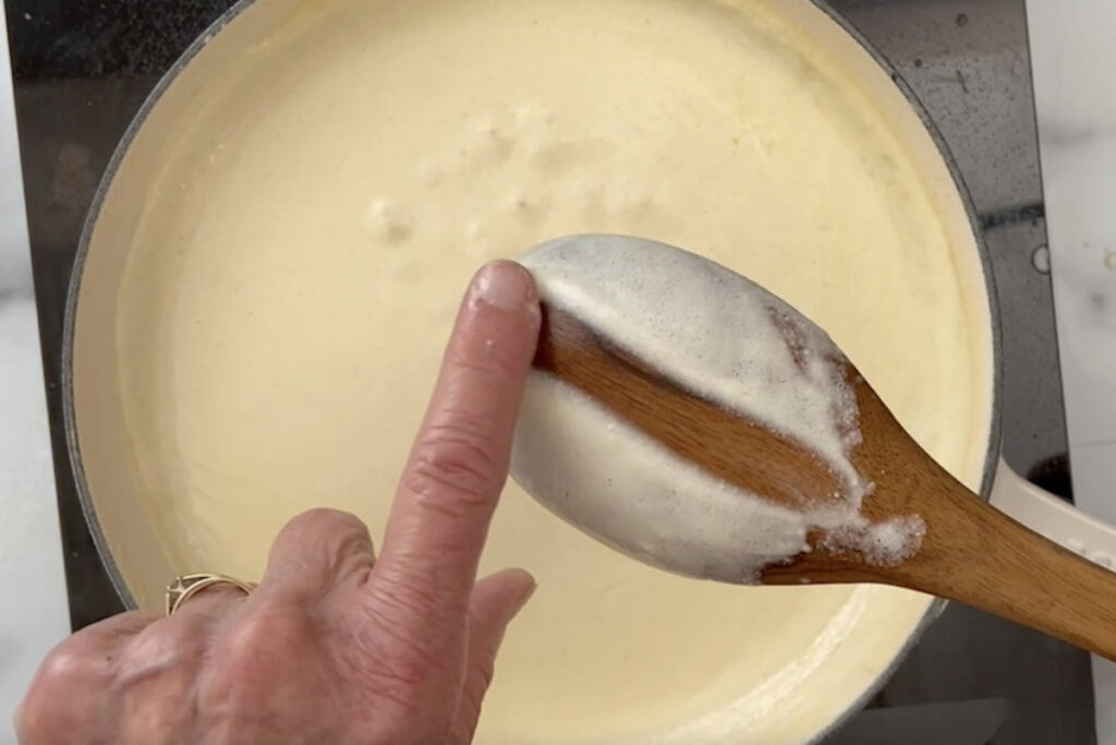 Checking the thickness on the back of a spoon.