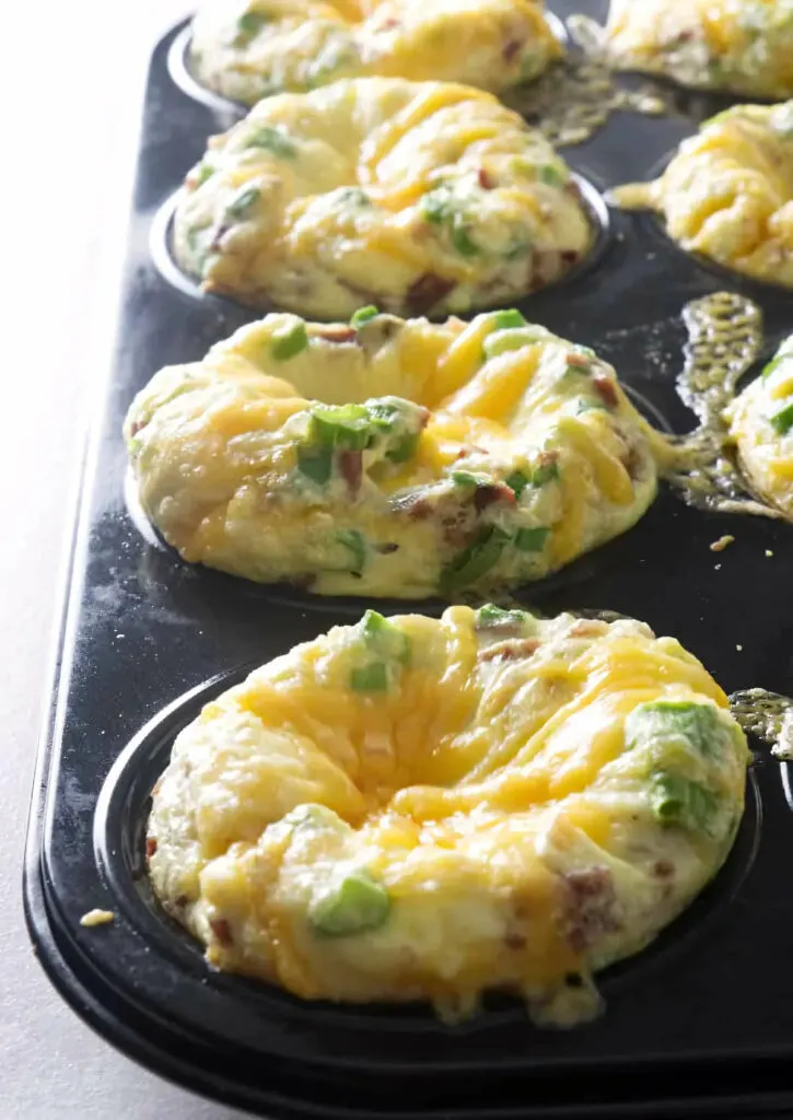 A muffin pan filled with egg bites.