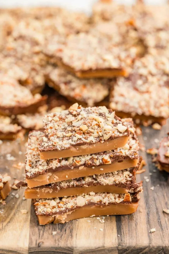 British toffee stacked on a cutting board after making individual pieces of candy.