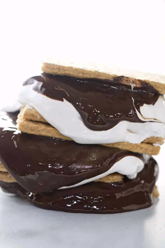 Fluffy marshmallow spread and chocolate sandwiched between graham crackers.