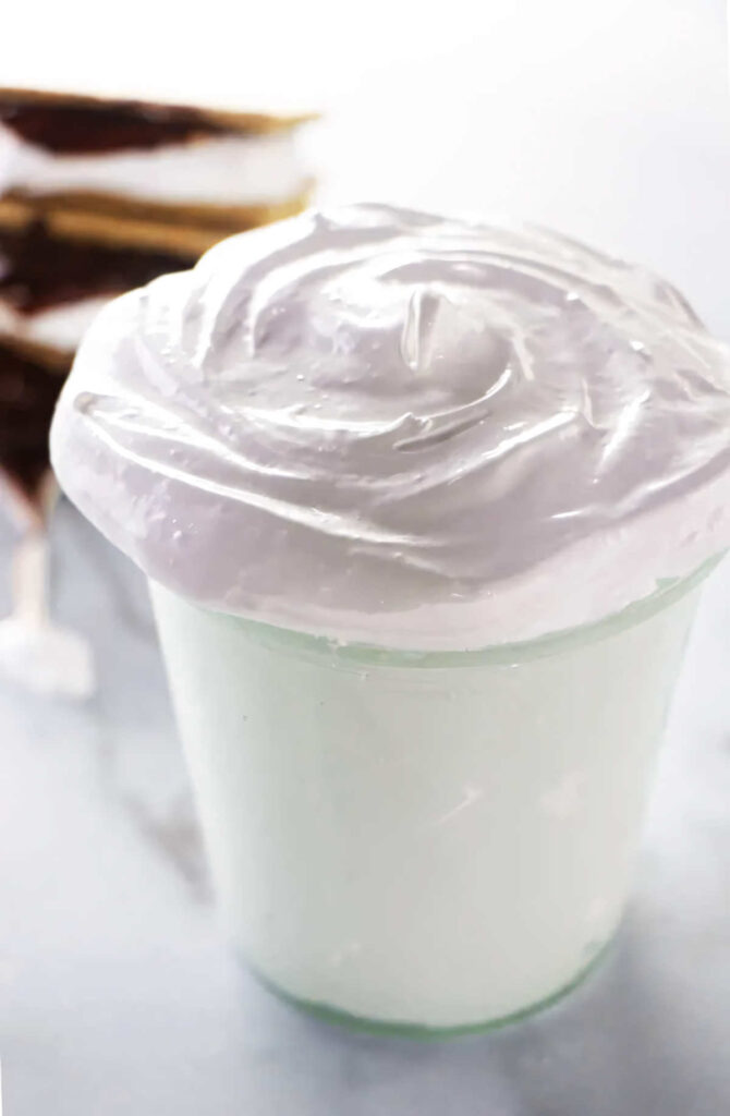 A jar of homemade marshmallow creme recipe.