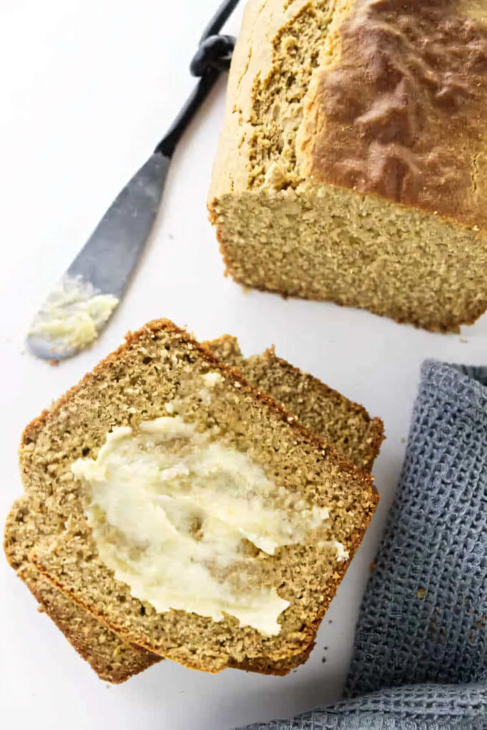 Slices of quick bread made with 100% barley flour with a smear of butter.