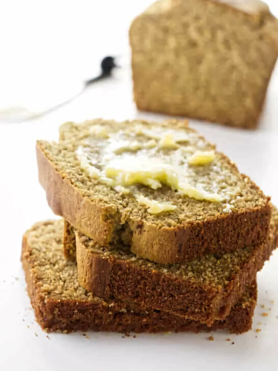 Several slices of barley bread on a counter.