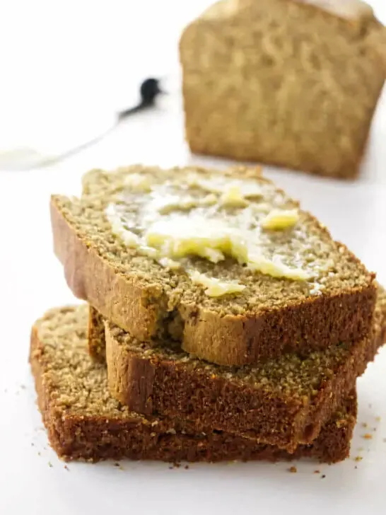 Several slices of barley bread on a counter.