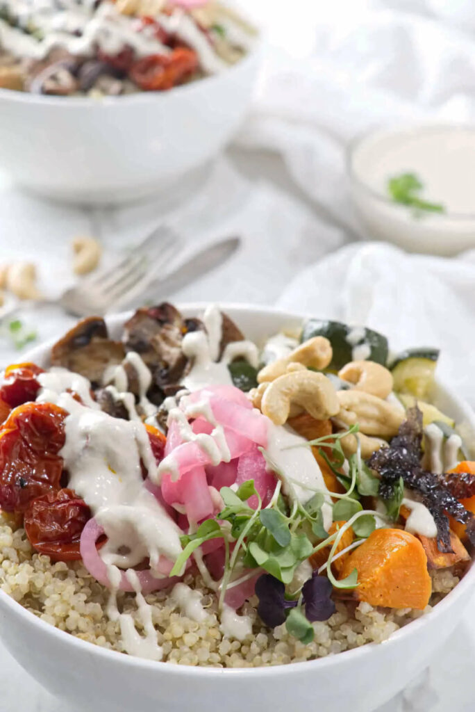 Cashews and roasted veggies on top of quinoa.