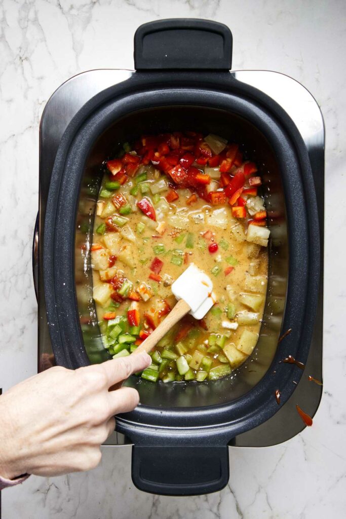 Stirring the cornstarch into the sweet and sour sauce.