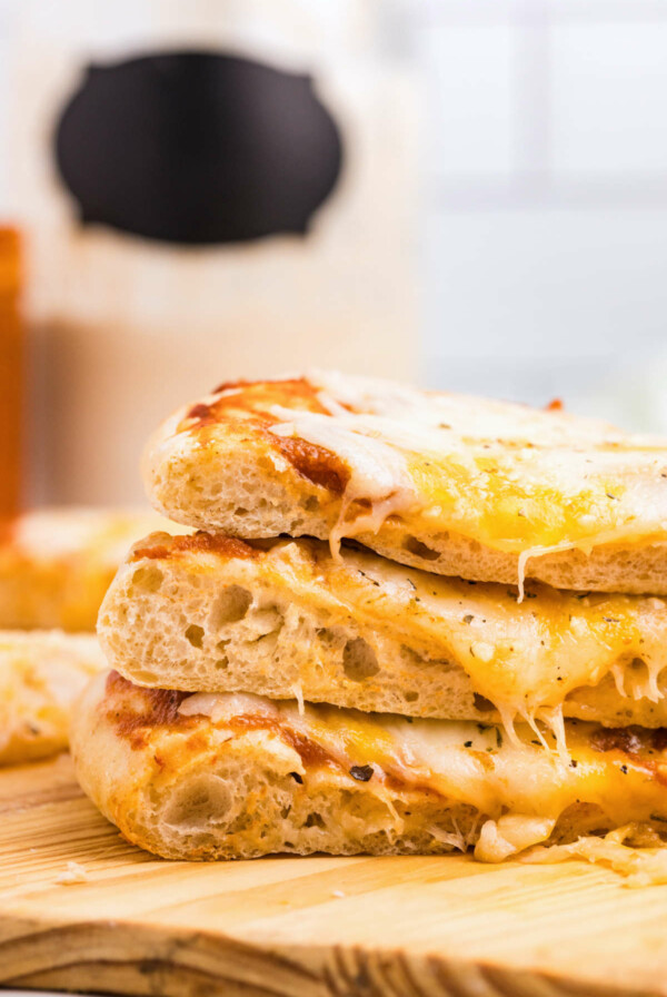 Three slices of sourdough pizza stacked on top of each other.