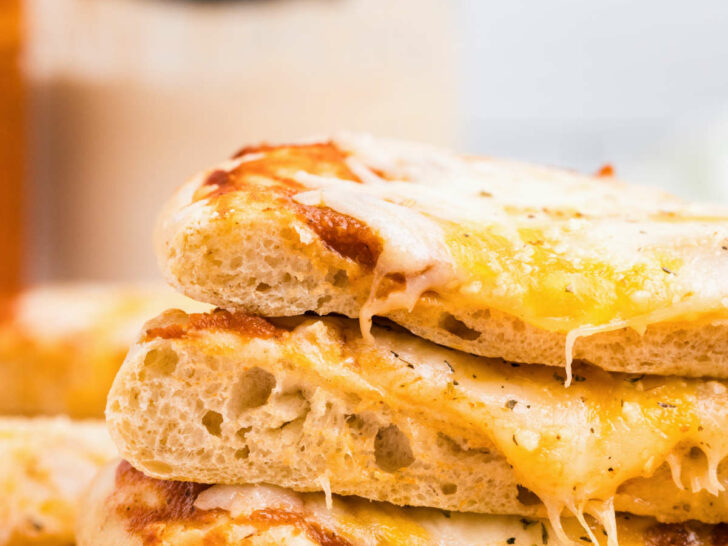 Three slices of sourdough pizza stacked on top of each other.