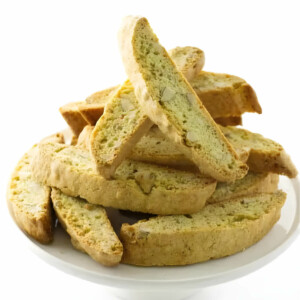 A serving platter filled with biscotti cookies made with almonds.