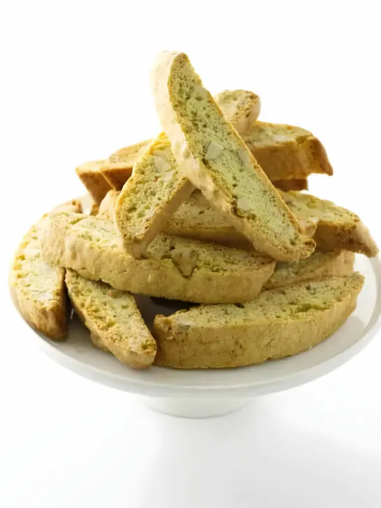 A serving platter filled with almond biscotti cookies.