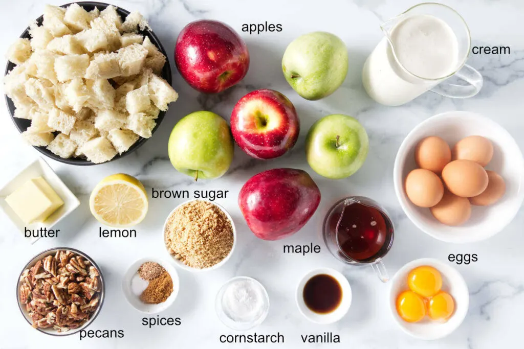 Ingredients used to make apple pecan bread pudding with maple sauce.