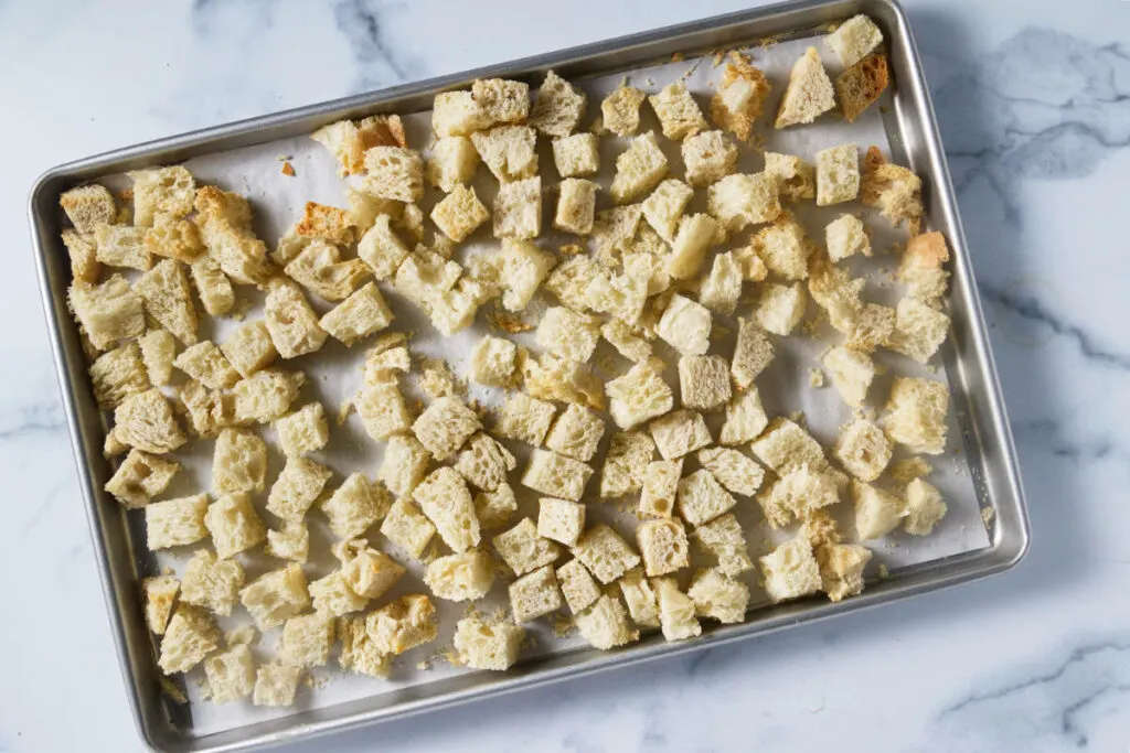 Toasting bread cubes in the oven.