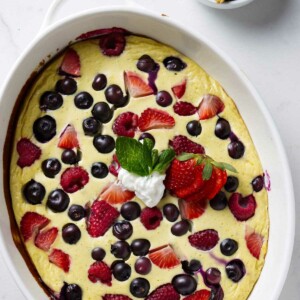 Yogurt bake in a dish with berries.