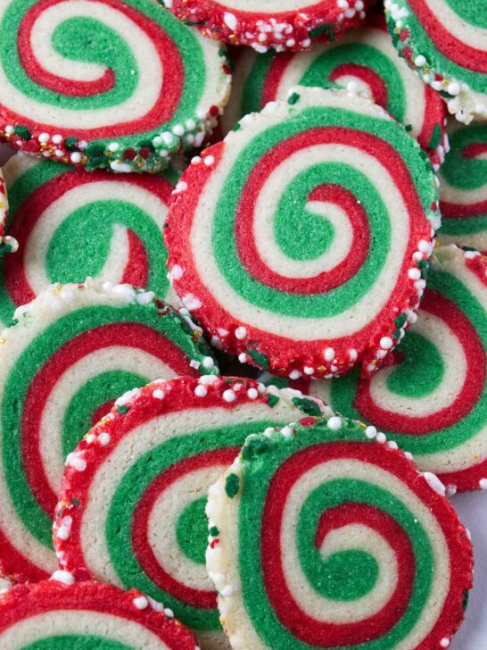 A plate of red and green swirled pinwheel cookies.