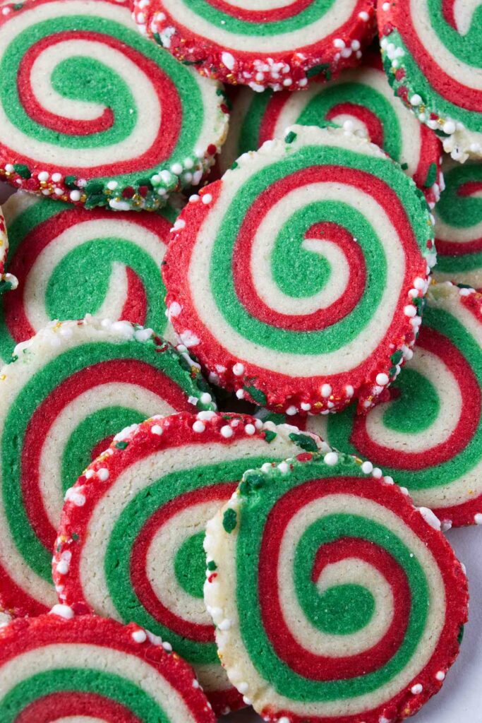 A plate of red and green swirled pinwheel cookies.