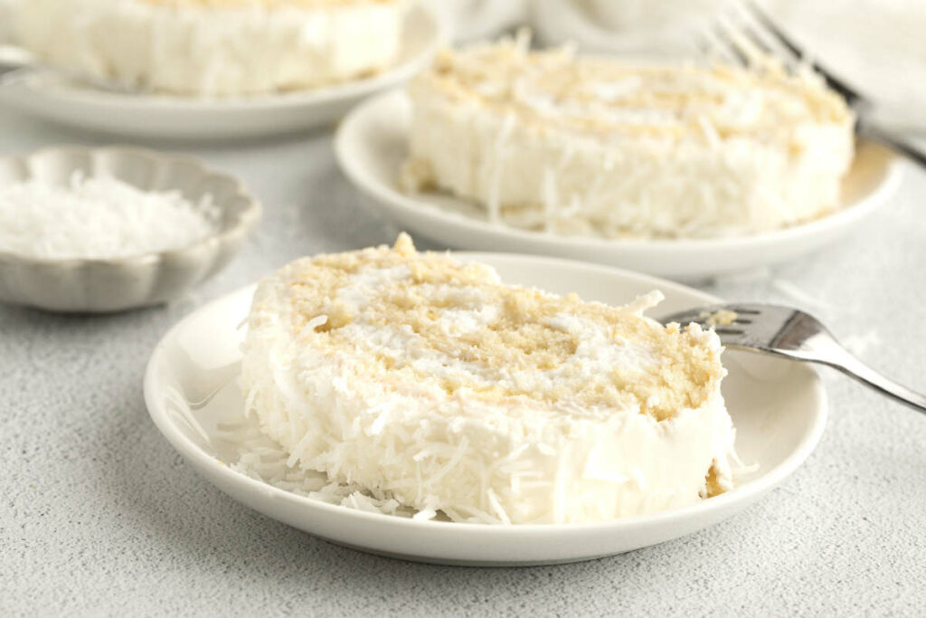 Several slices of a coconut roll cake.