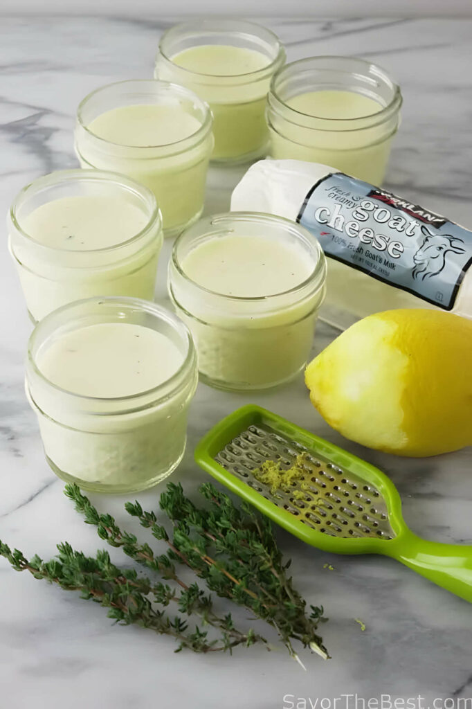 Several jars filled with goat cheese flan.