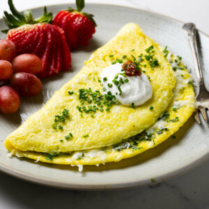 An omelet made with fresh herbs and cheese.