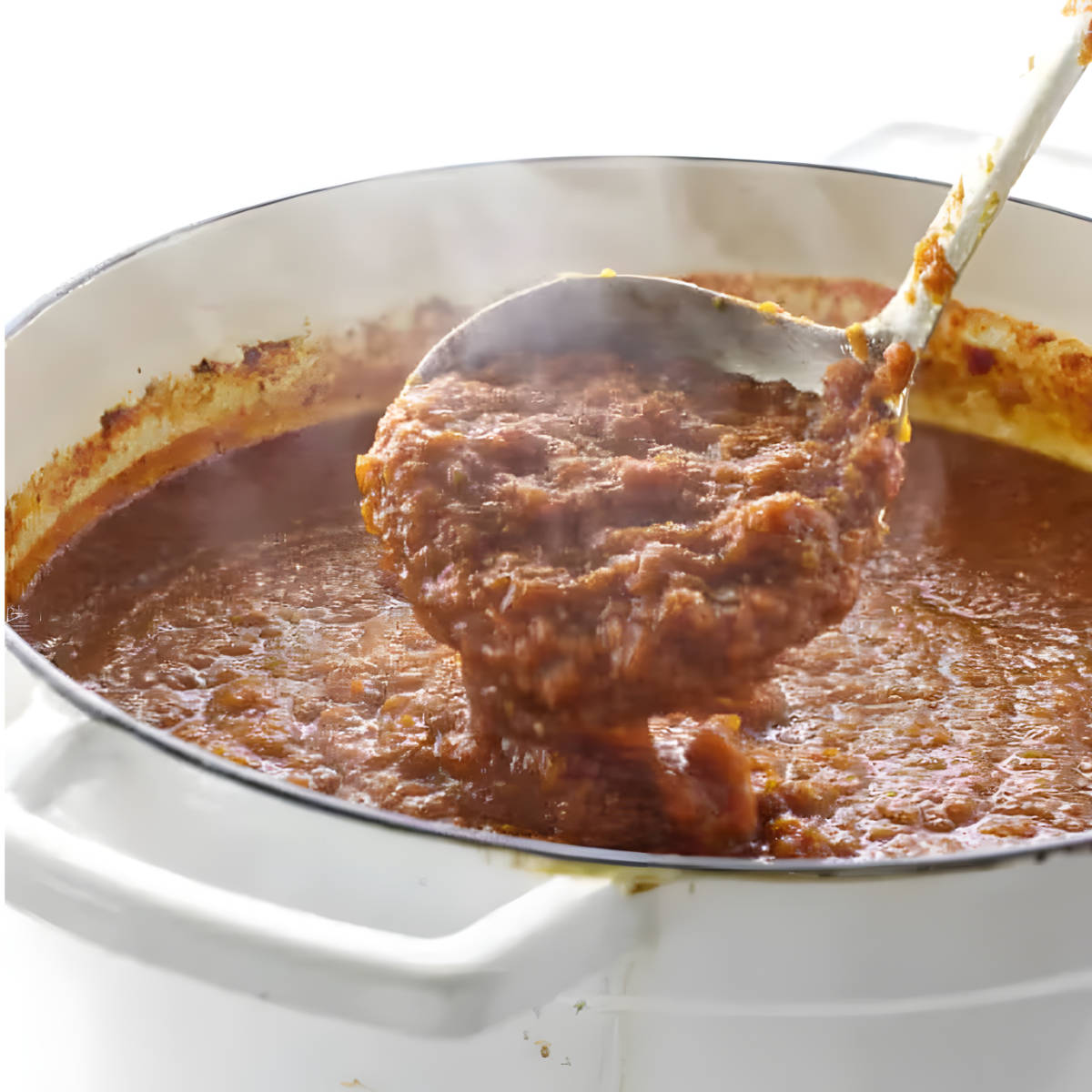 A ladle scooping red wine marinara sauce out of a pot.