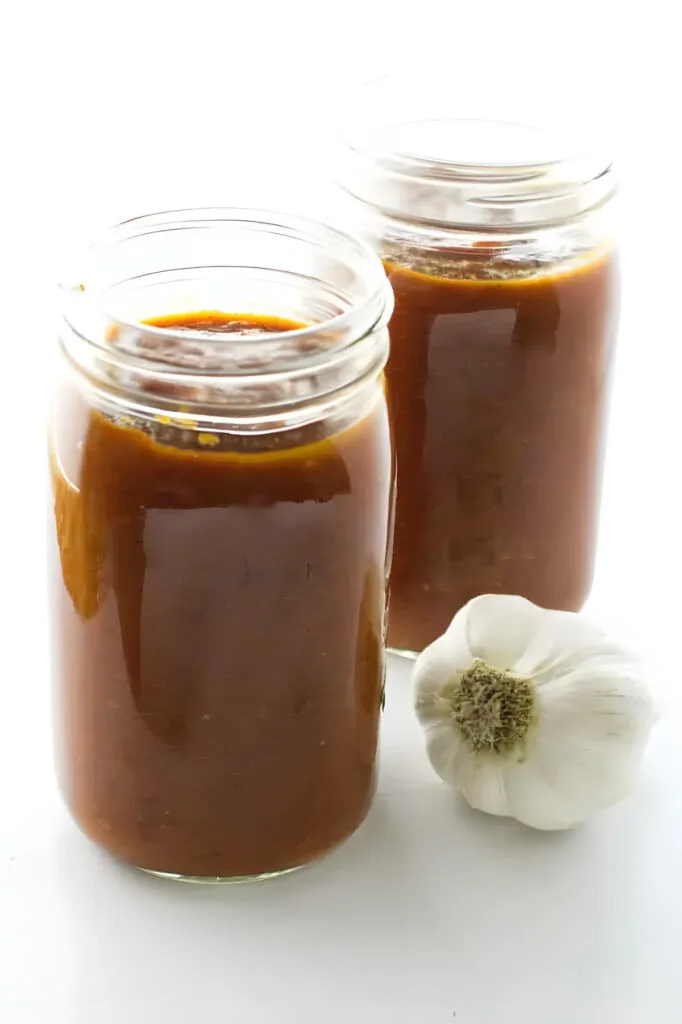 Two jars filled with red wine pasta sauce.