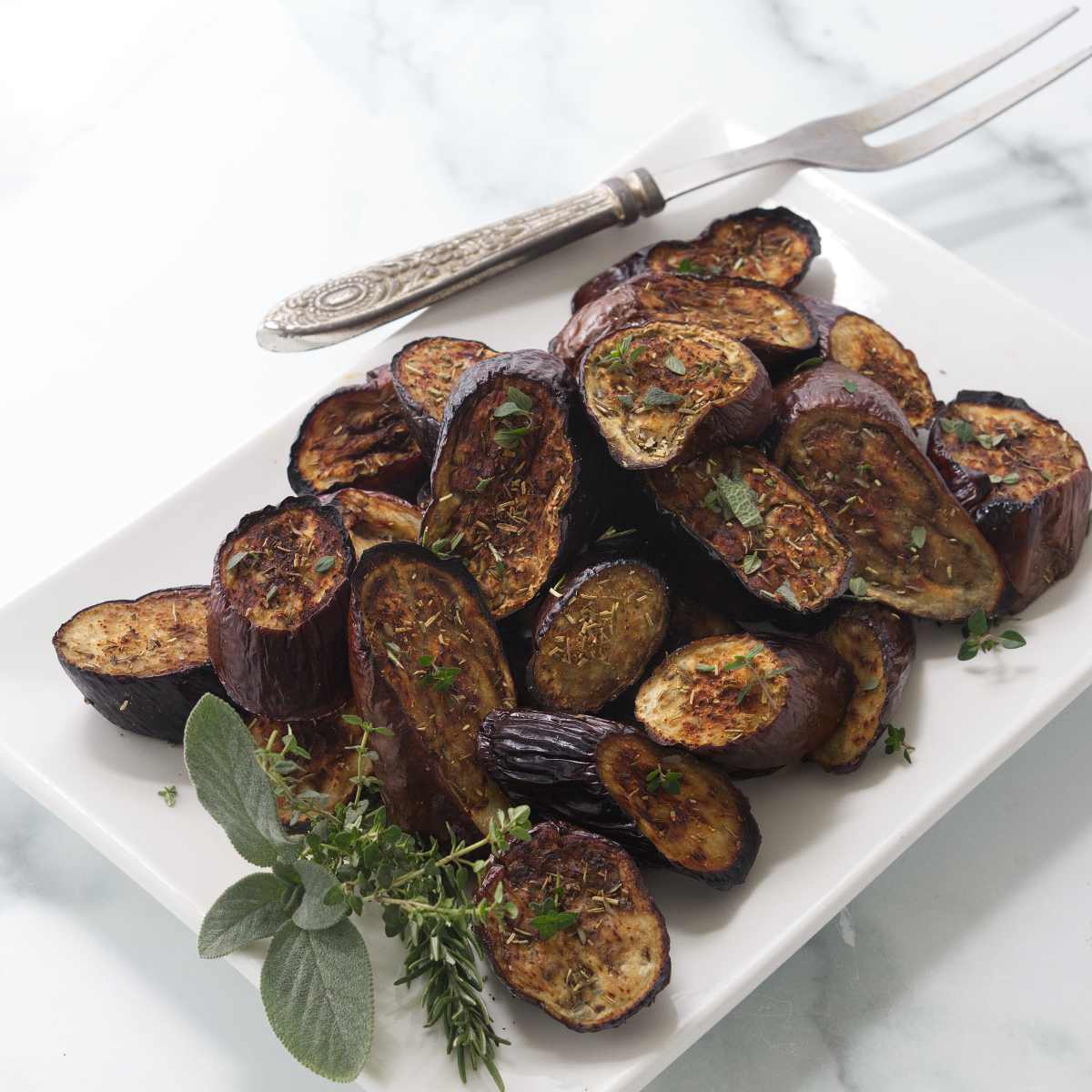 Baked eggplant on a serving platter.