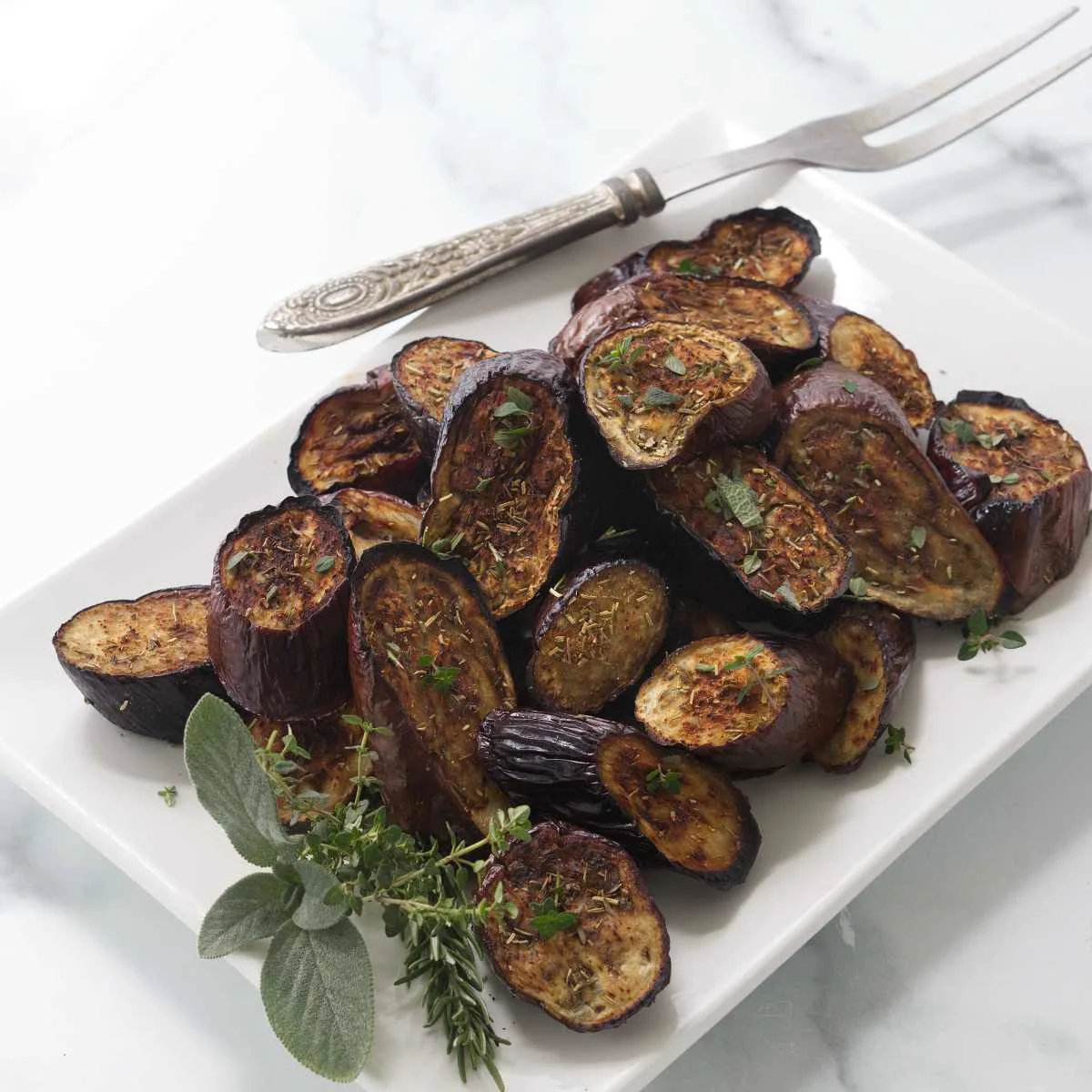 Baked eggplant on a serving platter.