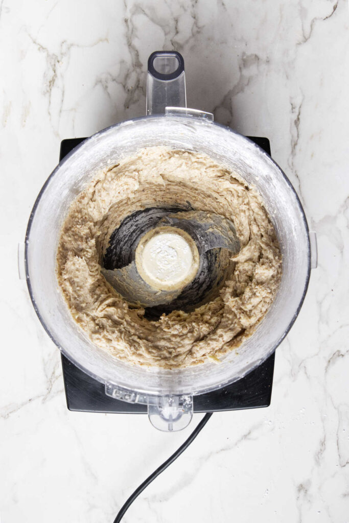 Pulsing the cookie dough in the food processor.