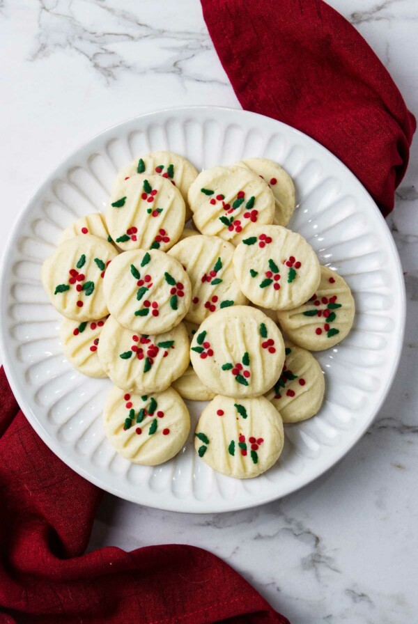 A plate filled with Christmas shortbread cookies.