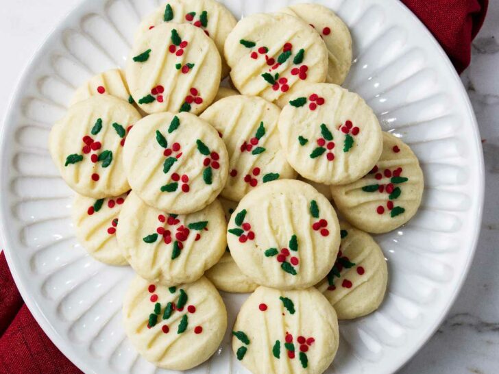 A plate filled with Christmas shortbread cookies.