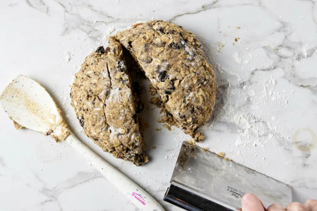 Dividing the whole wheat cookie dough into two sections.