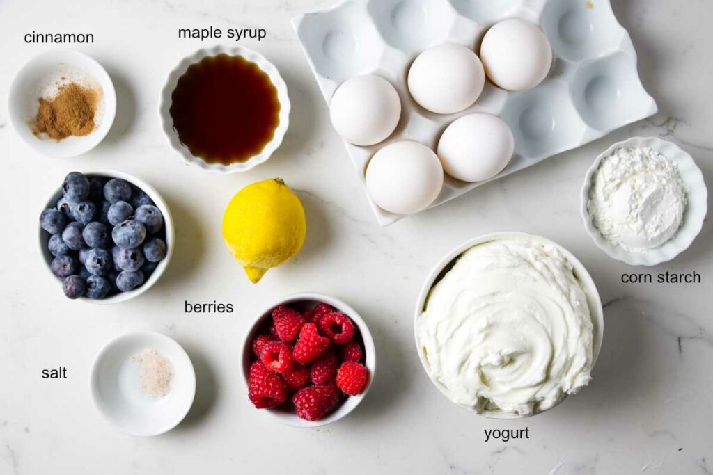 Ingredients used to make a breakfast yogurt bake with berries.