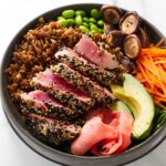 A ahi tuna bowl recipe with veggies and pickled ginger.