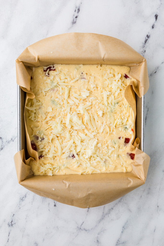 Cheese on top of cottage cheese egg bake before going in the oven.