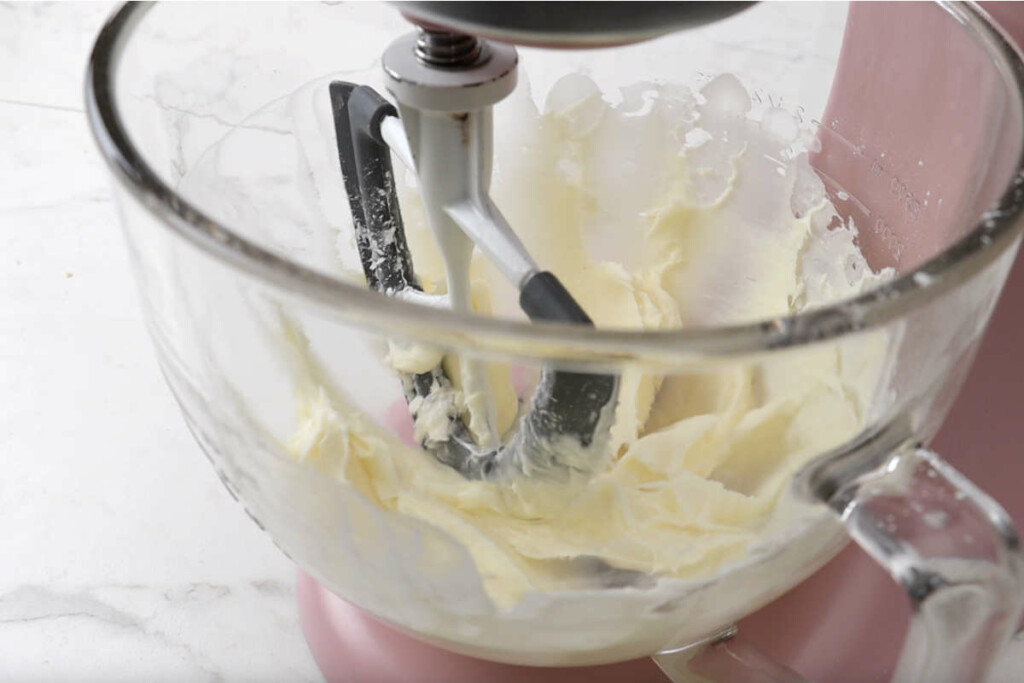 Mixing the cream cheese in a mixing bowl.