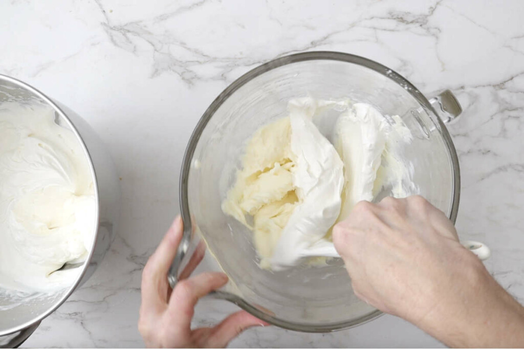 Folding the cream into the cream cheese for the valentines cake recipe.