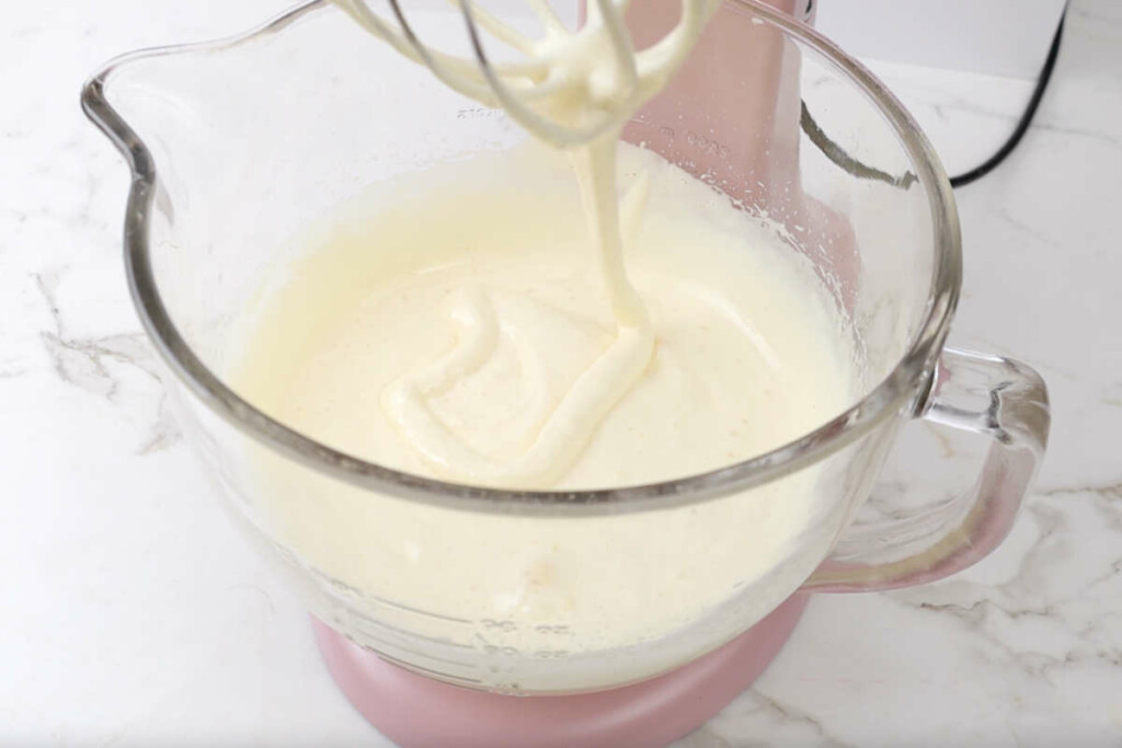 Whipping the eggs for the batter for strawberry valentine desserts cake roll.