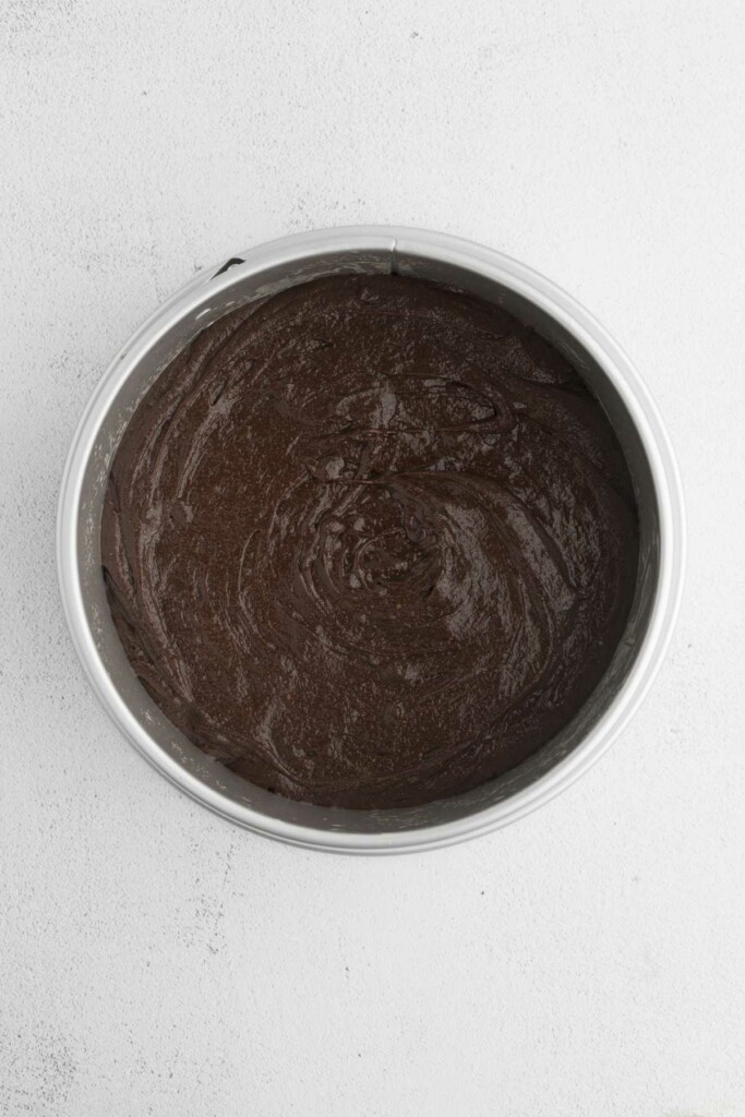 Spreading the brownie batter in the springform pan.