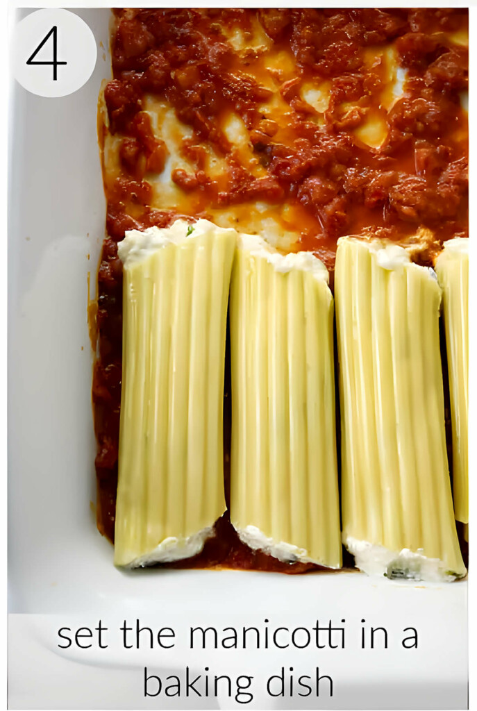 Placing ricotta cheese manicotti in a baking dish.