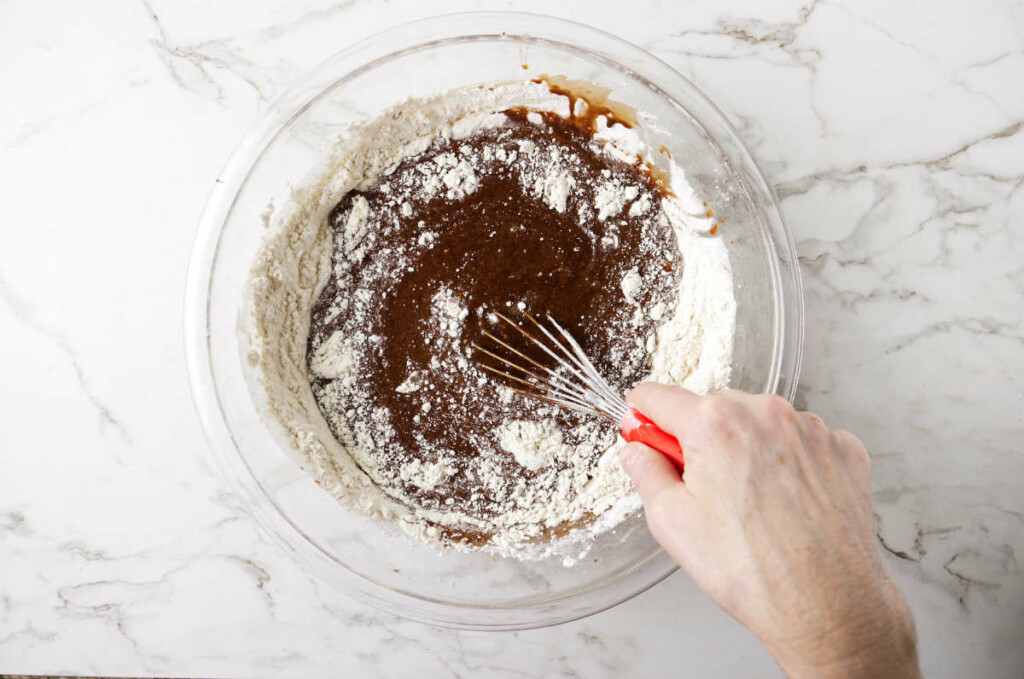 Mixing the cake batter with a whisk.