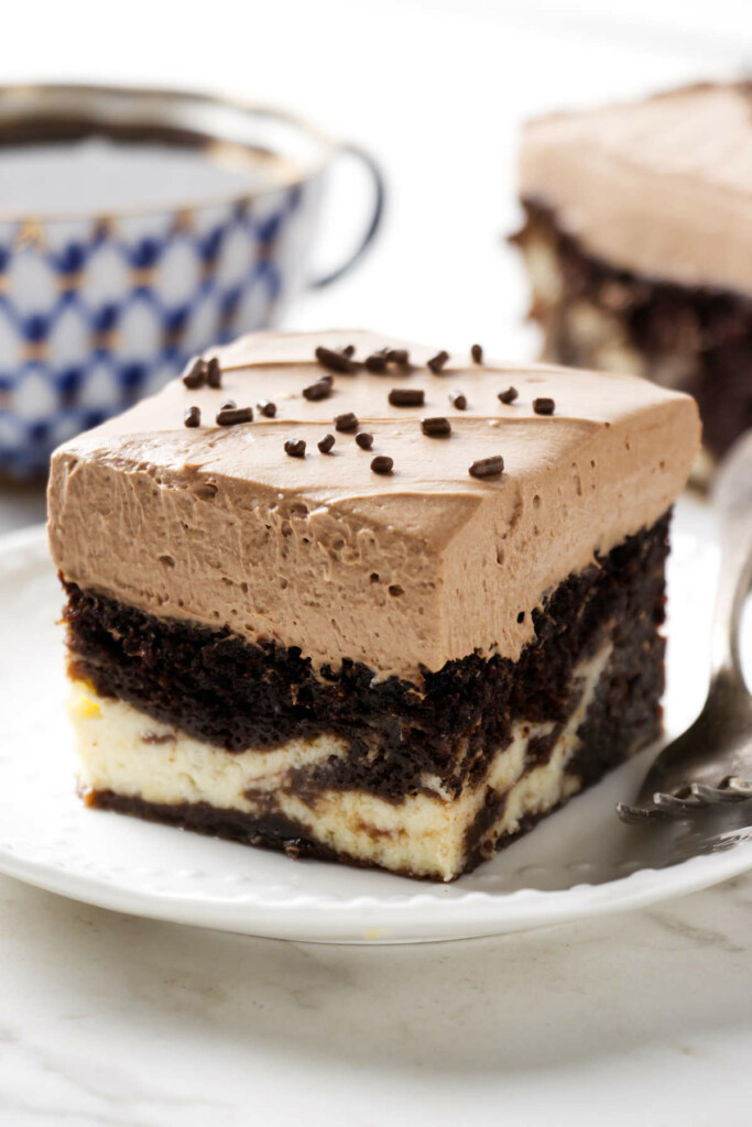 A slice of a Sicilian love cake on a plate with a fork.