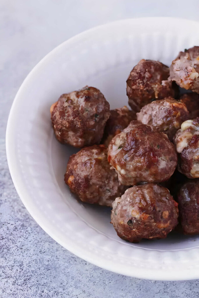 A dish filled with meatballs made without bread.