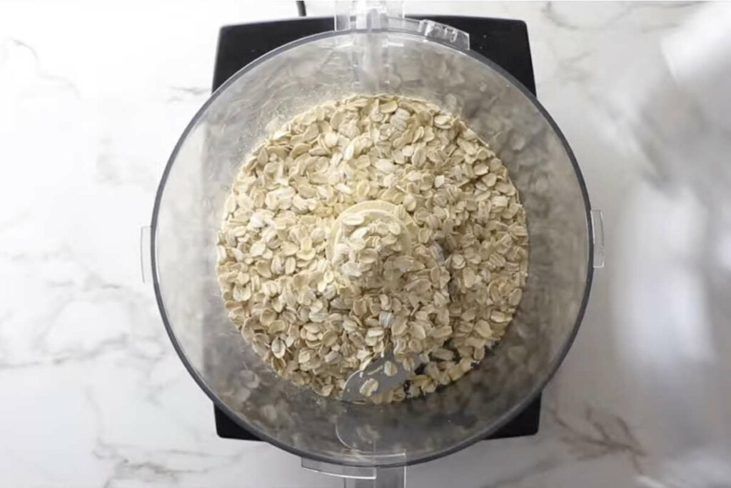 Rolled oats in a food processor to make oat flour.