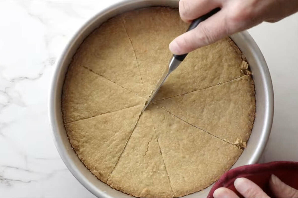 Slicing shortbread into bars.